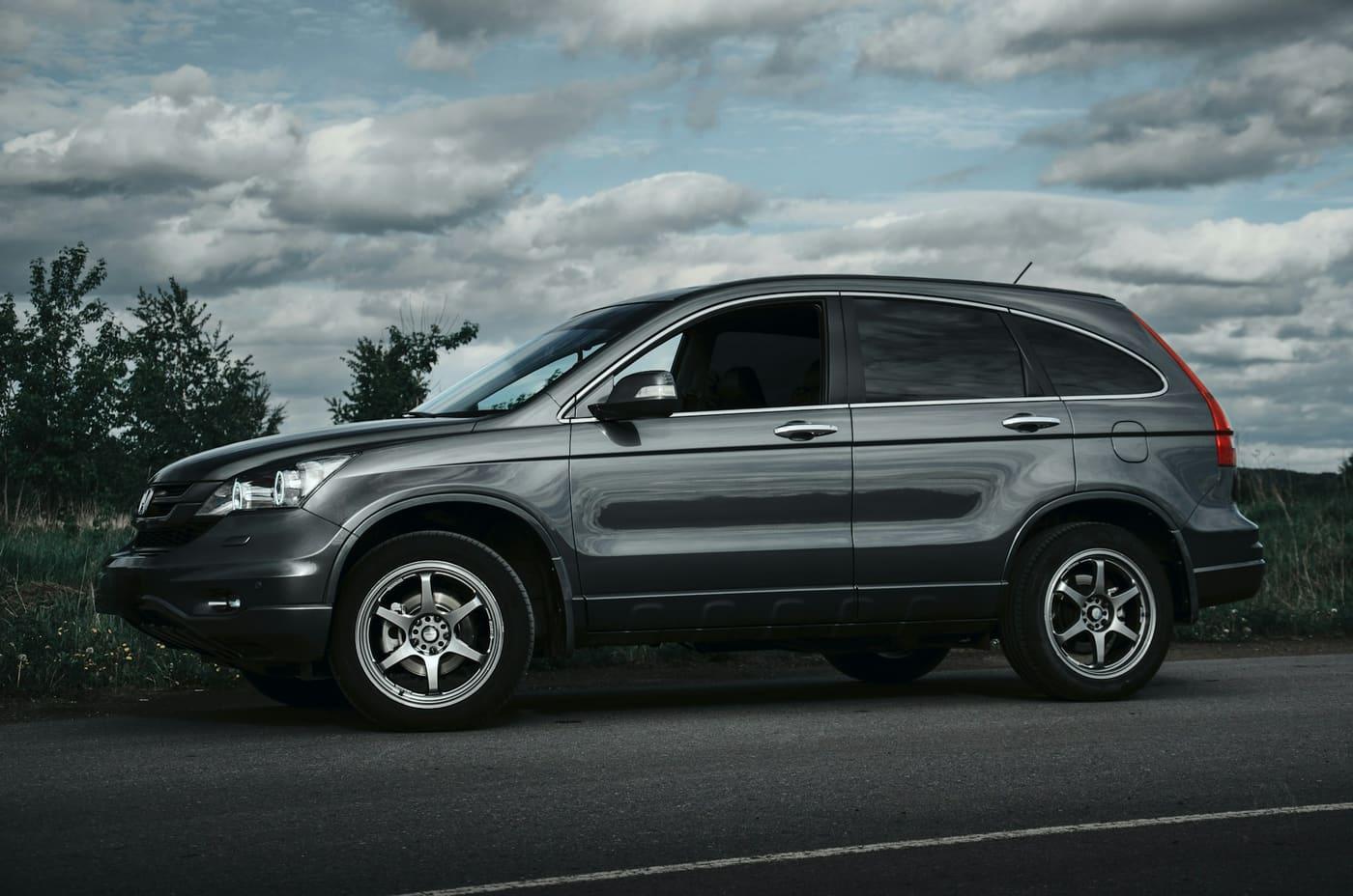 Grey SUV parked on an open road